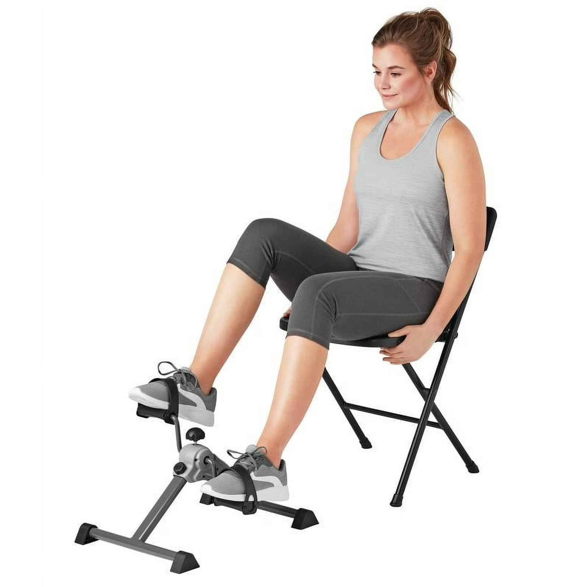 Mini pedal exerciser side view showing adjustable non-slip pedal straps and compact design